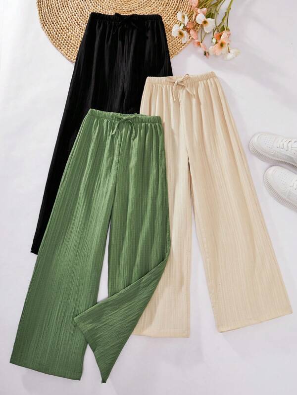 Dreiteiliger, lockerer, strukturierter Hosenanzug für Mädchen: grüne, lockere, strukturierte Hose, beige, lockere Hose und schwarze, strukturierte Hose, geeignet für lässiges Pendeln im Herbst und Winter, modisch und vielseitig.