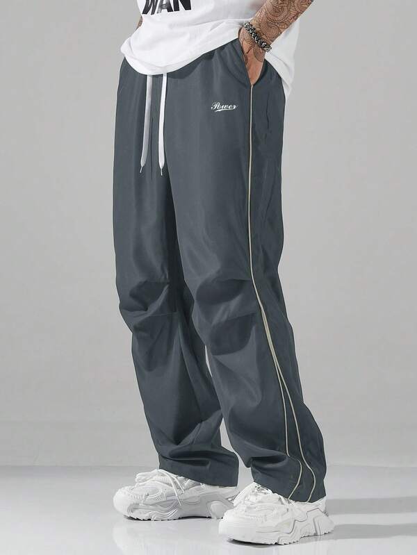 Herren-Freizeithose mit Buchstabendruck, Kordelzug in der Taille, plissierte Tasche, winddichte Jogginghose, lockerer Street-Style, schnell trocknende Fallschirmjäger-Arbeitshose im amerikanischen Retro-Stil, saubere Slim-Fit-Hose für Herren im Sommer, lo